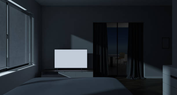 istock Modern master bedroom with white screen tv and balcony or patio area at night, 3d rendering. Digital illustration of a contemporary room with sliding window to a lounge zone, real estate generic image, copy space 1469204108