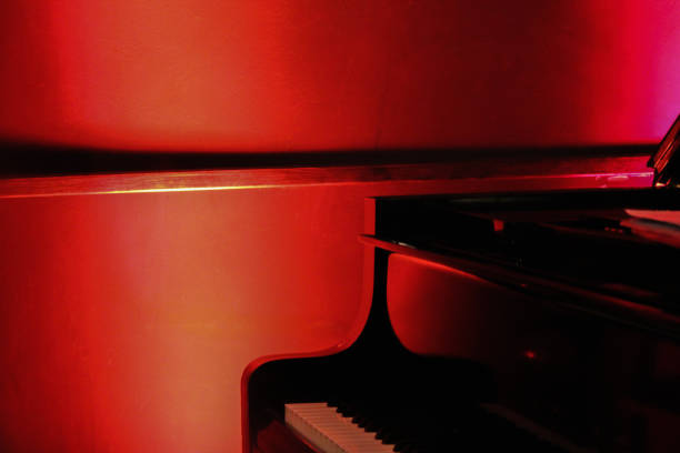 istock Piano under red light. Grand piano under red light for a Jazz concert. 1469204811