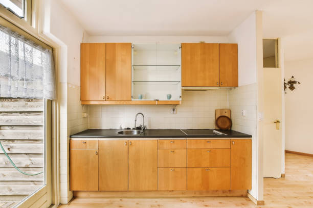istock a kitchen with wooden cabinets and a black counter top 1469205152