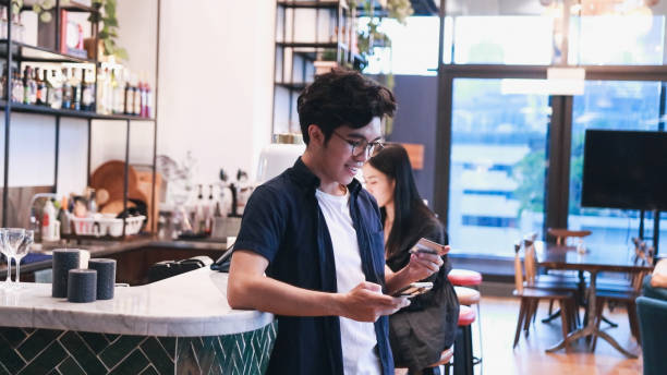 istock Ordering and paying at coffe shop with contactless payment 1469206867