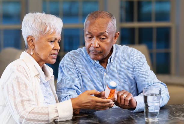 istock Senior African-American couple, taking medication 1469207856