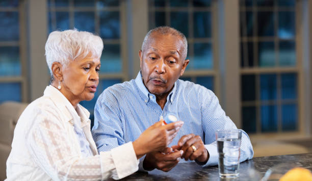 istock Senior African-American couple, taking medication 1469207859
