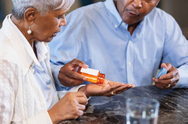 istock Senior African-American couple, taking medication 1469207877