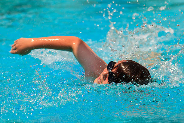 Boy Swimming Competitive with Goggles stock photo