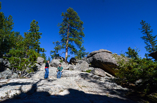 Custer State Park - Sylvan Lake Hike - Hikers Pause on Granite Hillside