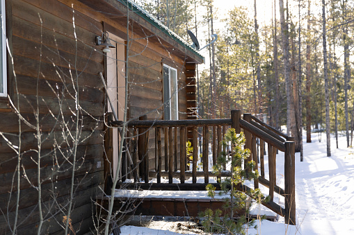 Front porch of a cabin in the snowy mountains of Colorado.