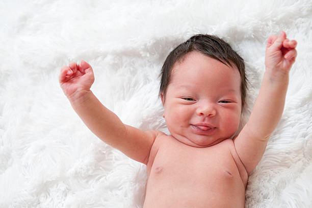 Happy newborn baby stock photo