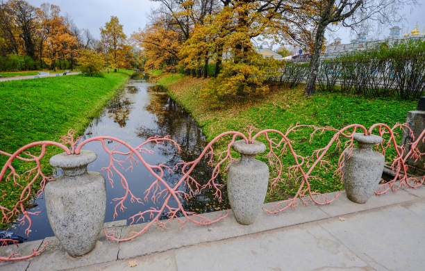 Decorations of ancient bridge at autumn garden in Saint Petersburg, Russia.