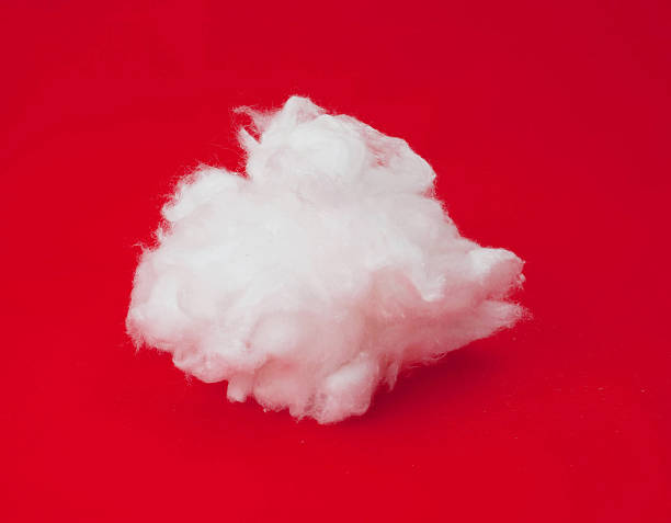 cotton wool cotton wool on a red background cotton cotton ball fiber white stock pictures, royalty-free photos & images