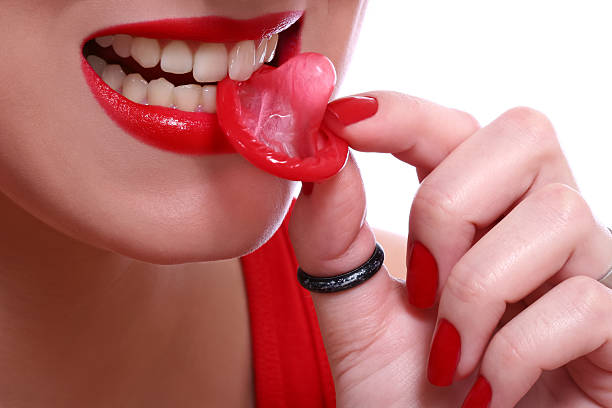 istock girl and condom isolated on white 146921518