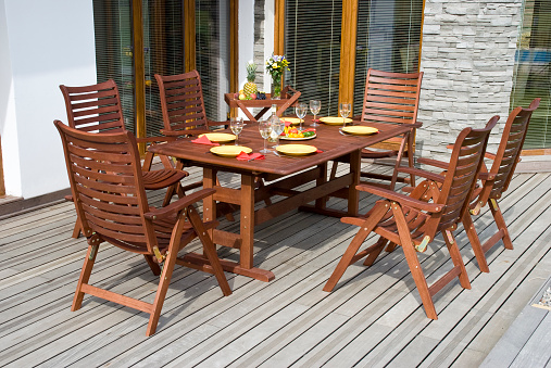 The Garden furniture by the house patio and with place setting
