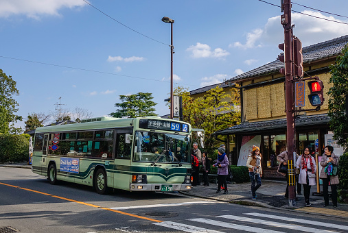 Kyoto, Japan - Dec 26, 2015. A local bus stopping at station in Kyoto, Japan. Kyoto was the capital of Japan for over a millennium.