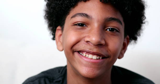 istock Mixed race young boy smiling at camera portrait. Ethnically diverse male kid 1469216426