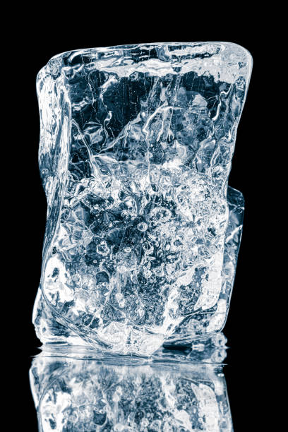 istock Crystal clear frosty textured natural ice block on black mirroring surface with reflection. 1469216930