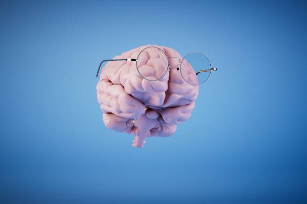 istock the concept of idea generation. brain in glasses on a blue background. 3D render 1469219748