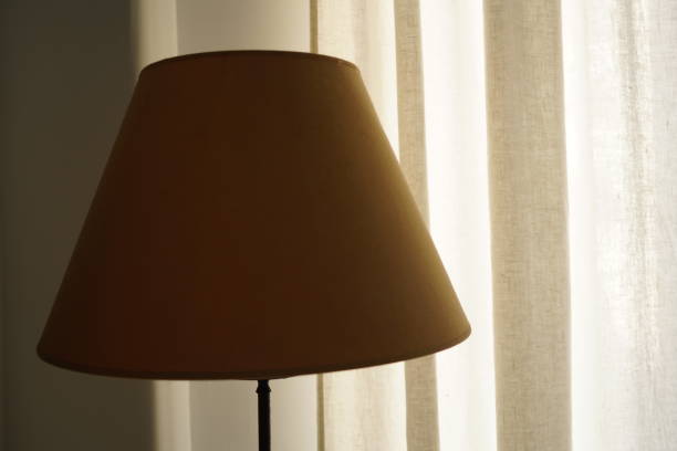 istock lamp off in a room 1469220110