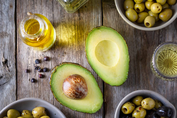 Avocado, olives and oil stock photo