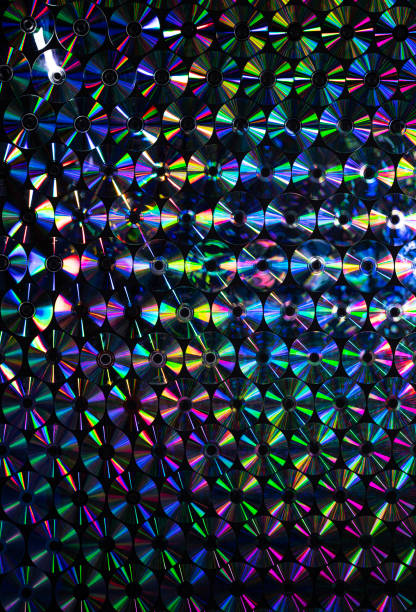 Textured background of large group of multicolored CDs
