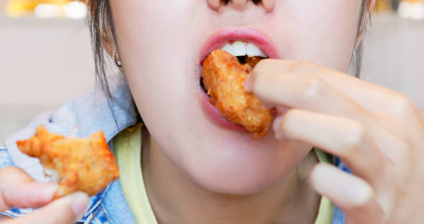 istock asian woman eating 1469222701