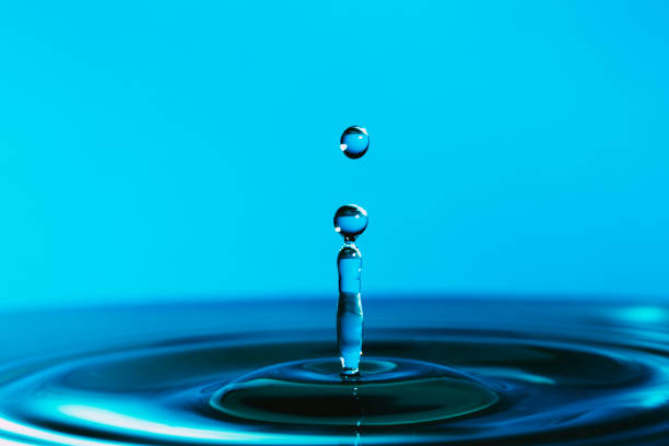 istock Macro close up of water drop with blue background 1469224170