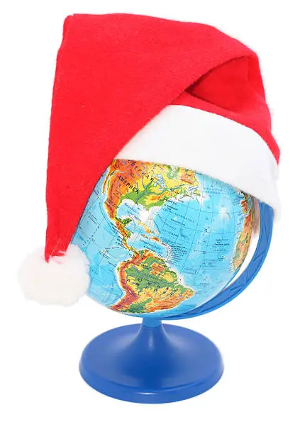 Photo of globe wearing a Santa Claus hat