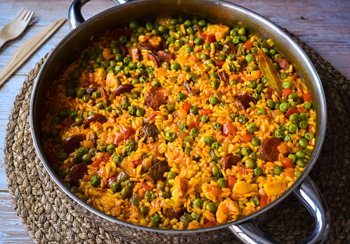 paella with red sausage and peas