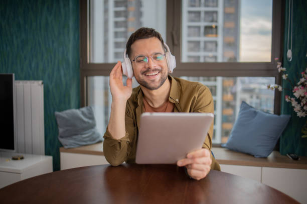 Portrait of an excited man enjoying music stock photo
