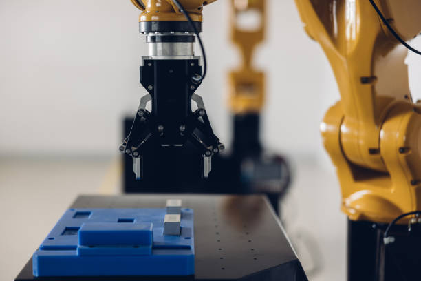 istock New Generation Robotic Arm Ready for Work on a Production Line. New robot arm  for the production line of industrial factory. Robot arm manipulator at the factory. Industrial automation technology. 1469230242