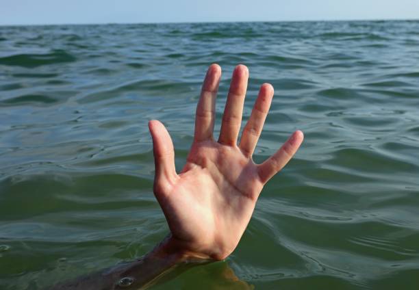 istock people hand while drowning and asking for help symbol of depression 1469230949