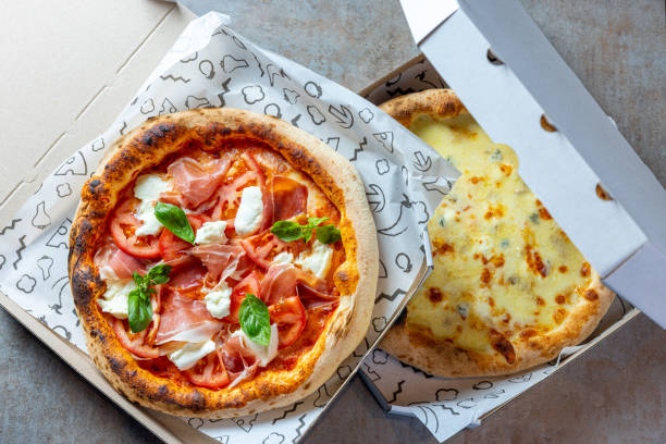 istock Two types of pizza delivered in boxes 1469231006