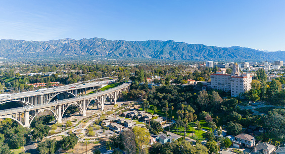 Drone view of Pasadena, California with bridge, mountains and hotel.