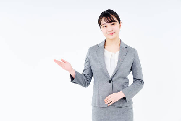 A woman in a suit posing for guidance
