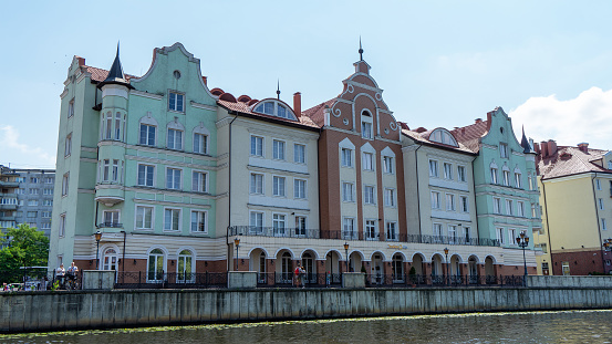 Residential multi-storey buildings in Fishing village, Kaliningrad, Russia. Embankment of Pregolya River. Views of city and streets of Kaliningrad.