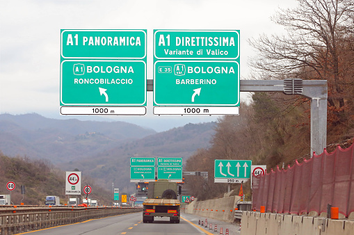 italian Road Signal at crossroad and name of two way to Florence called DIRETTISSIMA And Variante di Valico
