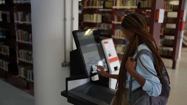 Student searching for a book in the library system