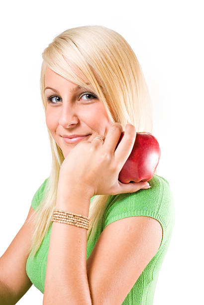istock Cute young blond girl holding an apple. 146923765