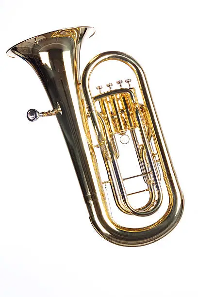 A gold brass tuba euphonium isolated against a white background in the vertical format.
