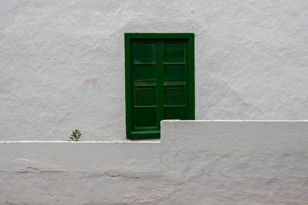 istock White house with green shutter window, Spain 1469238689