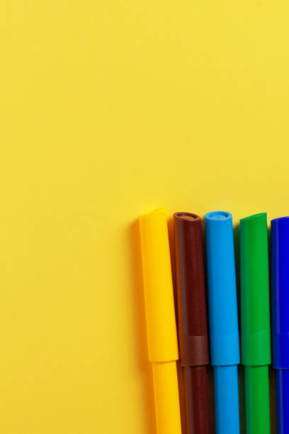 istock Markers of different colors on a yellow background. 1469240101