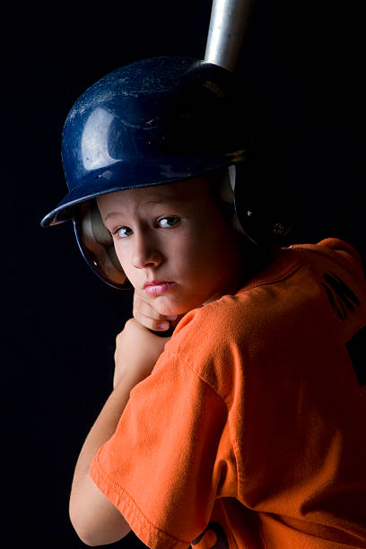 istock Youth Baseball Player with Black Background 146924144
