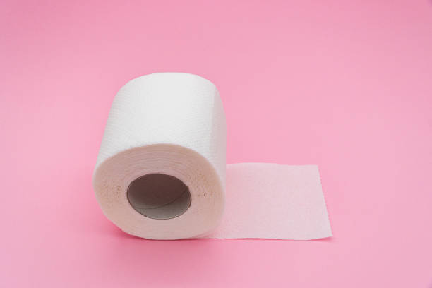 istock White simple toilet paper on pink background 1469241880