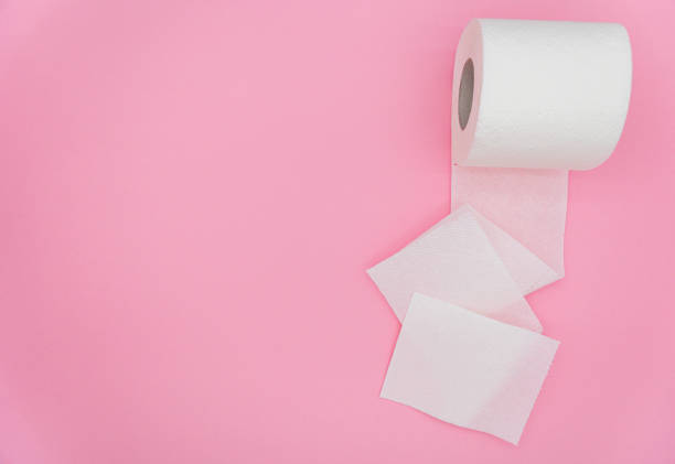 istock Unrolled toilet paper on color background, top view. Space for text 1469241902