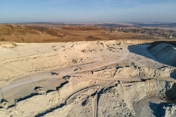 istock Aerial view of open pit mining site of limestone materials for construction industry with excavators and dump trucks 1469243364