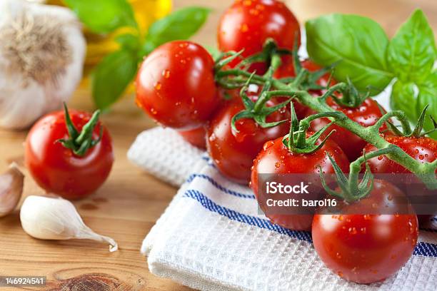 Fresh Cherry Tomatoes And Basil On Kitchen Towel Stock Photo - Download Image Now - Basil, Cherry Tomato, Close-up