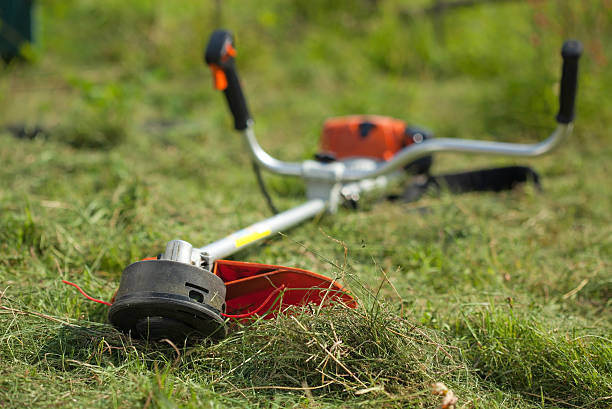 istock lawn mower on green grasss 146924563