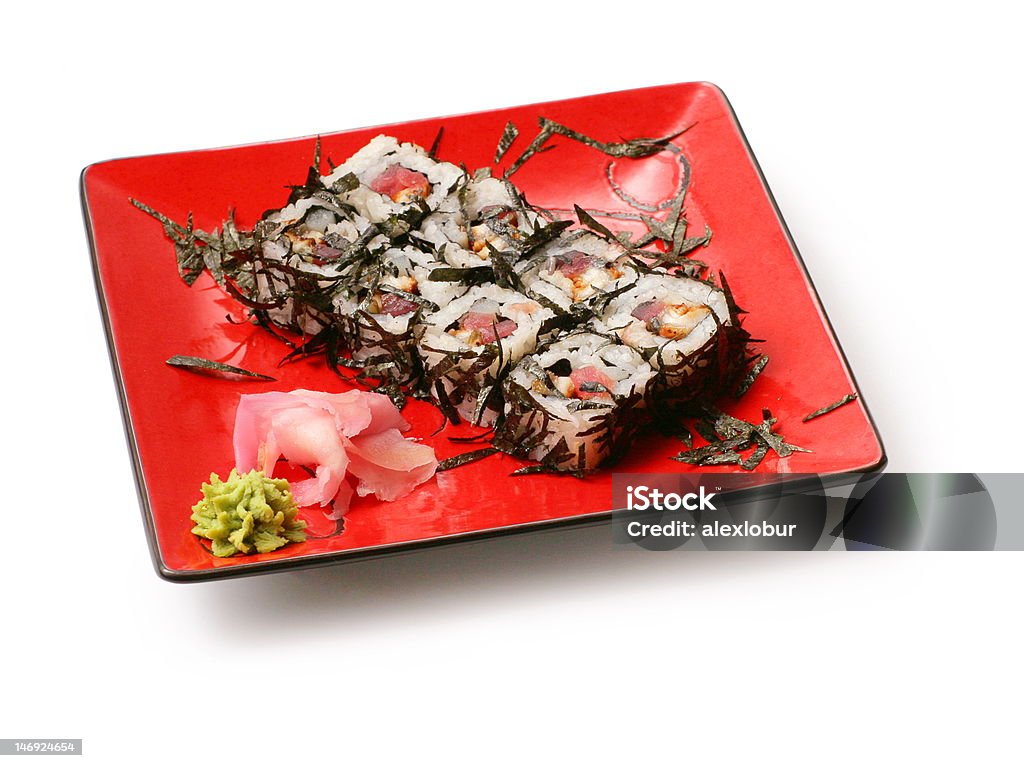 Rolls with seaweed, salmon and octopus in red squared plate Rolls with seaweed, salmon and octopus in red squared plate over white background Chinese Food Stock Photo