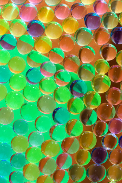 istock colorful abstract 3d glass ball with colors reflection 1469249372