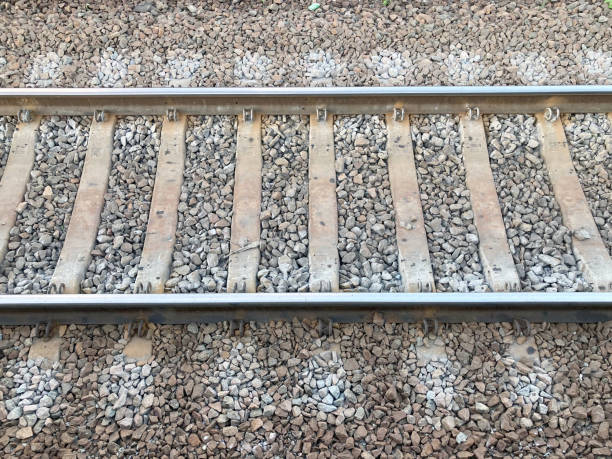 Railway rails and sleepers view from above up close Railway rails and sleepers view from above close up railroad track concrete railway sleeper thoroughfare stock pictures, royalty-free photos & images