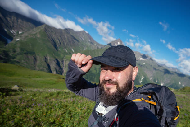 istock Smiling hiker taking selfie high up in the mountains 1469250961