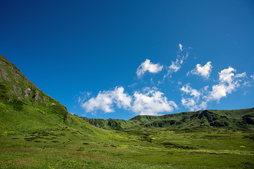 Stunning summer landscape of green Caucasus mountains at sunny day